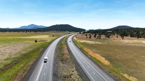 Bright aerial drone shot capturing bustling traffic on two parallel American Stock Footage 346889626