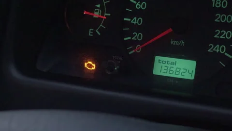 Bright amber indicator light signals immediate attention required for vehicle Stock Footage 327932469