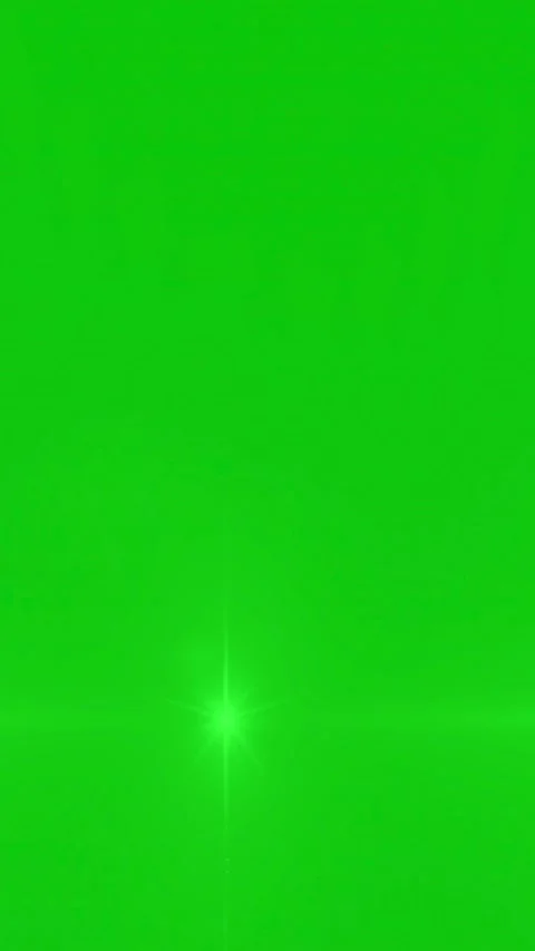 Bright anamorphic lens flare glowing and moving on a green screen background Stock Footage 339044236