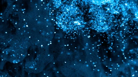 Bright and blue particles floating on a smoky nebulous dark background - full hd Stock Footage 51149468