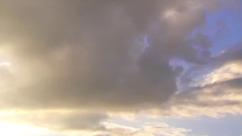 Bright and colorful clouds bathing in the evening sunlight Stock Footage 99116793