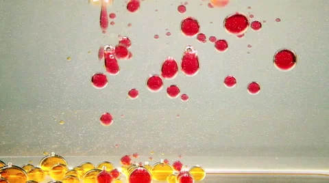 Bright and colorful multi-colored liquid in motion. Lava lamp with green, yellow Stock Footage 62231958