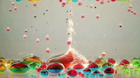 Bright and colorful multi-colored liquid in motion. Lava lamp with green, yellow Stock Footage 62232324
