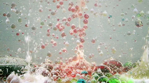 Bright and colorful multi-colored liquid in motion. Lava lamp with green, yellow Stock Footage 62232702