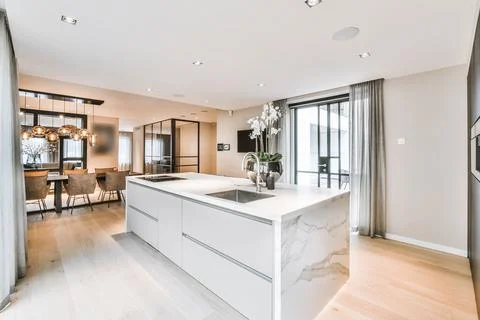 Bright and modern kitchen design Stock Photos