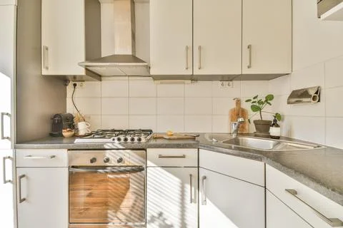 Bright and modern kitchen design Stock Photos