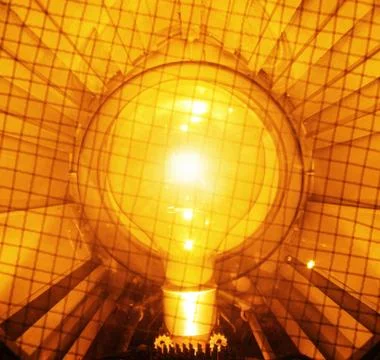 Bright and orange light bulb Stock Photos