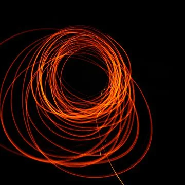 Bright and shining patterns of fire, night entertainment with fire, various p Stock Photos