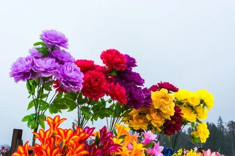 Bright artificial flowers. Stock Photos