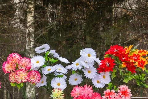 Bright artificial flowers. Stock Photos