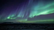 Bright Aurora Borealis Snow Covered Lava Mountains Iceland Realistic Movement 4K Stock Footage