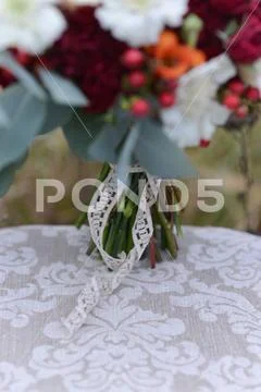 Bright autumn wedding bridal bouquet, standing on a chair in the woods. floral Stock Photos
