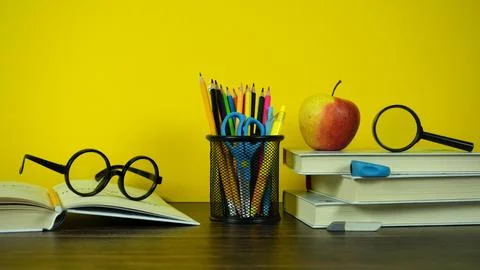 Bright Back to School Study Desk With Books, Pencils, Glasses And Apple Stock Photos