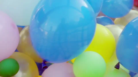 Bright balloons of different sizes move chaotically Stock Footage 157884216