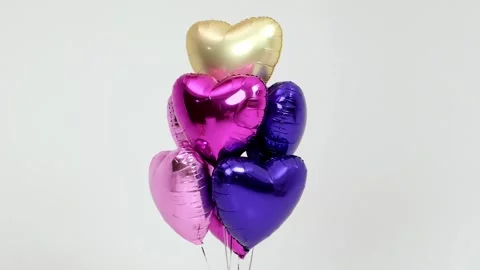 Bright balloons on a light isolated background Stock Footage 264046666