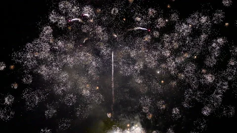 Bright barrage of small fireworks full screen Video stock 235058067