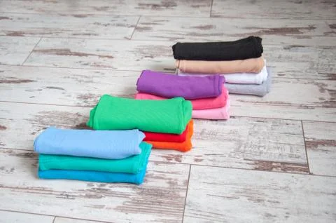Bright base clothes stacked Stock Photos