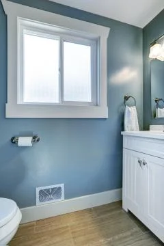Bright bathroom in light blue Stock Photos