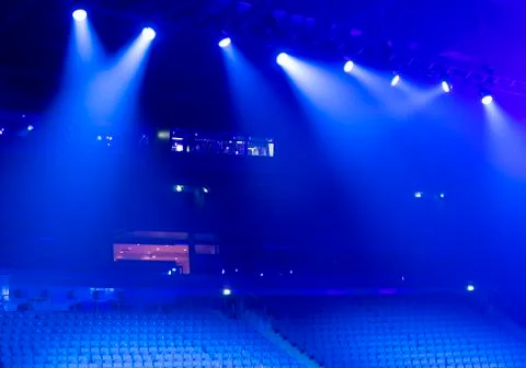 Bright beautiful rays of light on an stage before the concert. Stock Photos