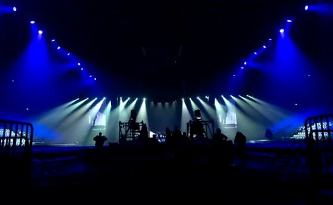 Bright beautiful rays of light on an stage before the concert. Stock Photos