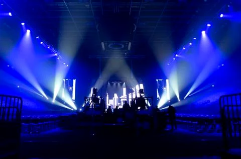 Bright beautiful rays of light on an stage before the concert. Stock Photos