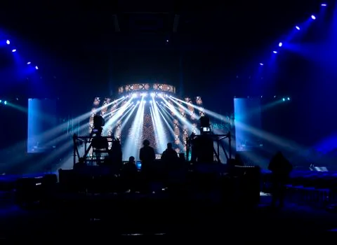 Bright beautiful rays of light on an stage before the concert. Stock Photos