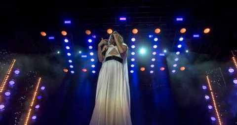 Bright beautiful rays of light on an stage before the concert. Stock Photos