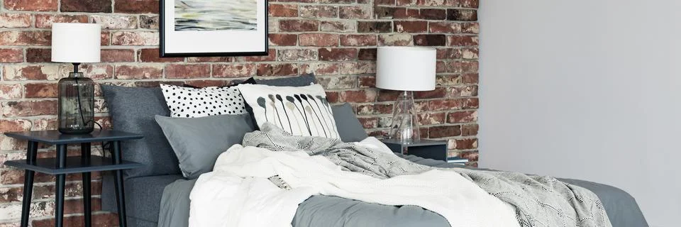 Bright bedsheets on bed Stock-Fotos