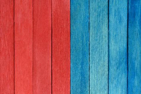 Bright bicolor background from red and blue wooden planks. Fotos de archivo