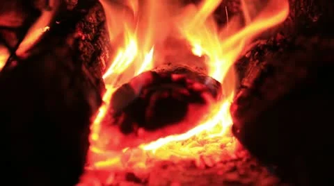 Bright blaze macro zooming in fire place Stock Footage
