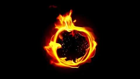 A bright blazing ring of fire with small random sparks, slowly spinning in .. Stock Footage 311366562