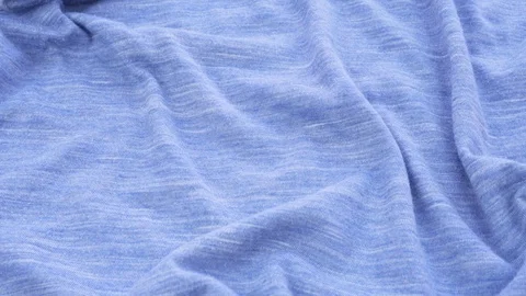Bright blue background from a fabric close-up. 库存影片 121901369