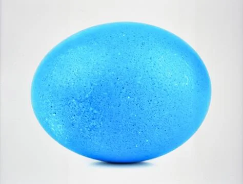 Bright Blue Bird Egg Isolated on White Background Representing Biotic Life .. Stock Photos