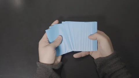 Bright Blue Cards Spread Across Desk Stock Footage 100557376