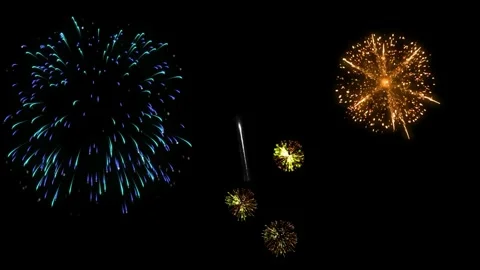 Bright blue firework exploding in night sky with glowing sparks and dynamic 스톡 동영상 342893773