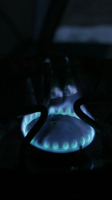 Bright Blue Gas Flame Burning on Portable Camping Stove at Night Stock Footage 341996950