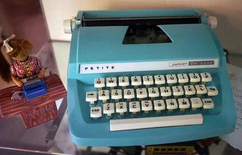  A bright blue junior typewriter designed for young girls. Dated 20th Cent... Stock Photos
