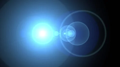 Bright Blue Lens Flare Effect with Subtle Light Streaks and Bokeh During a .. Stock Footage 342515070