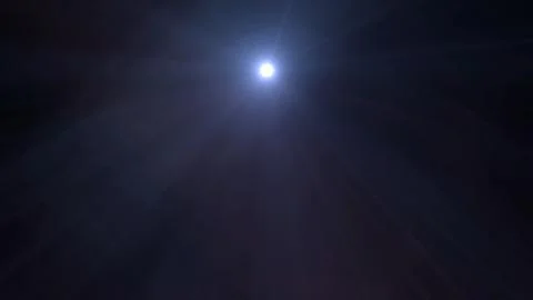Bright blue light shines through dark sky Stock Illustration