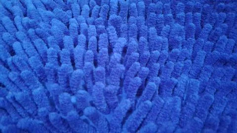 Bright blue microfiber bath mat texture with soft fuzzy bristles Stock Photos
