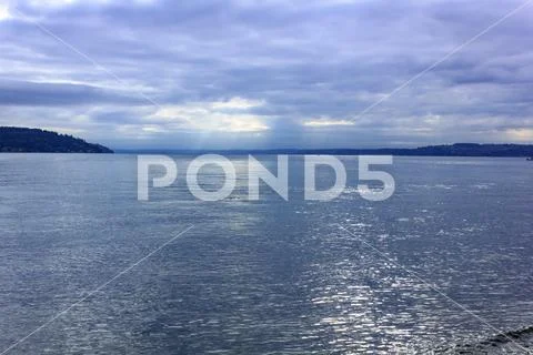 Bright blue morning with clouds on puget sound Stock Photos
