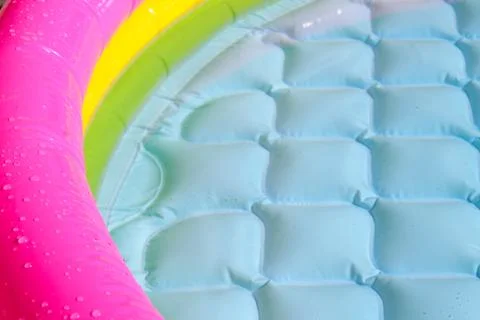 Bright blue paddling pool surface with water ripples Stock Photos