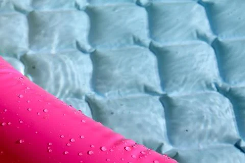 Bright blue paddling pool surface with water ripples Stock Photos
