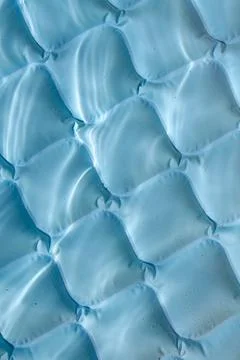 Bright blue paddling pool surface with water ripples Stock Photos