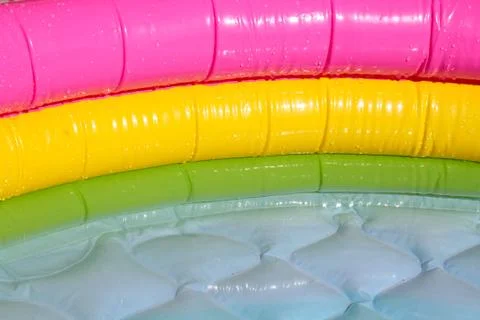 Bright blue paddling pool surface with water ripples Stock Photos