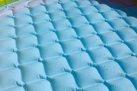 Bright blue paddling pool surface with water ripples Stock Photos