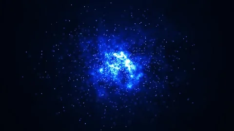 Bright blue particles explode in a dark space background, creating a Stock Footage 314060684