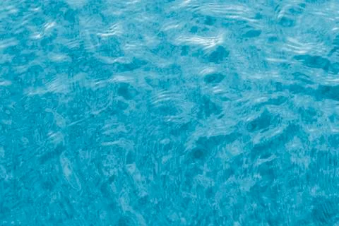 Bright blue pool water. Stock Photos