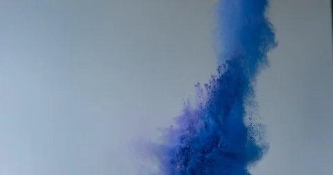 Bright blue powder explode and erupt on light gray background Stock Footage 98213135