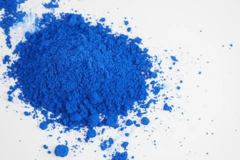 Bright blue powder on white surface Stock Photos